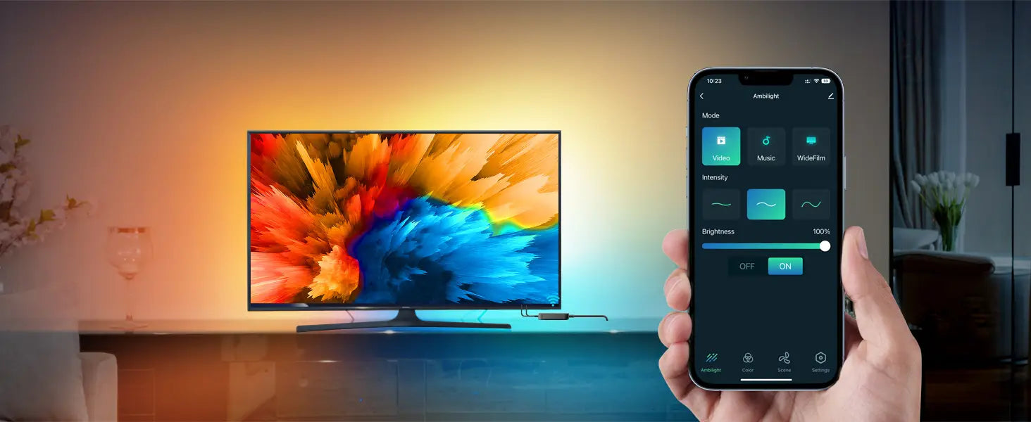 Smart TV displaying colorful abstract image, with smartphone showing TV control app interface in foreground.
